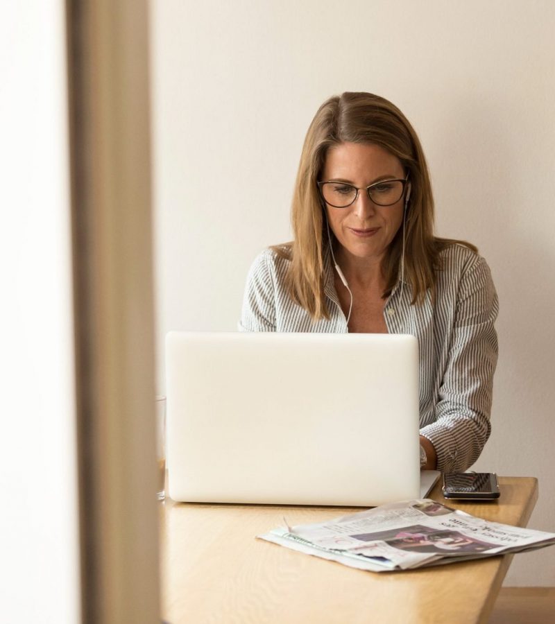 woman-sitting-while-using-laptop-1251828